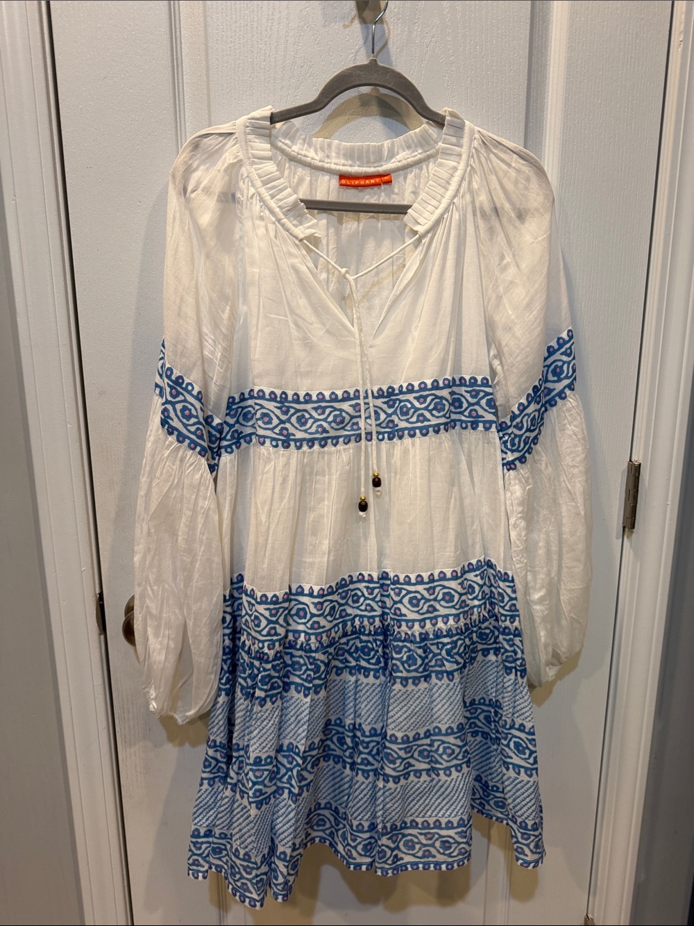 Oliphant White Top with Orange Logo Tag